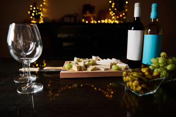 Elegant cheese and wine pairing setting with festive lights in background