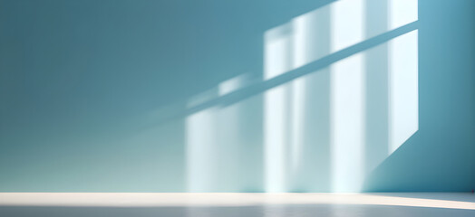 Light blue wall with the shadows of window frames falling on it