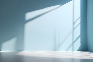 Sunlight casting shadows in empty room with blue walls