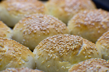 Homemade flour buns with sesame seeds