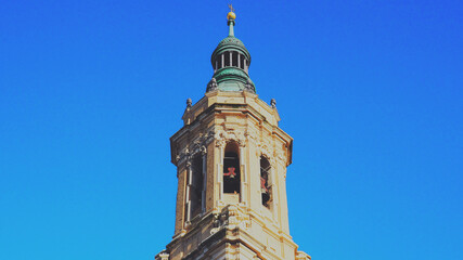Obraz premium Church Tower Against Bright Blue Sky