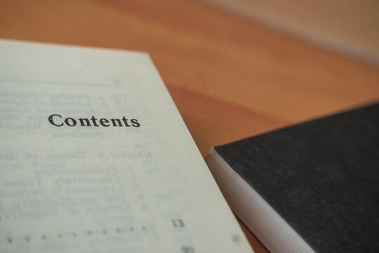 zoom in on a page of a book with the word contents