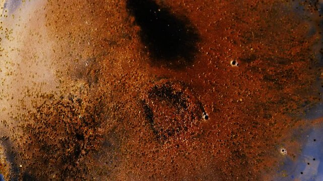 Abstract background in macro style, dissolution of paint in water, beautiful texture of shimmer and color, movement of color streams