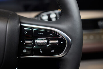 The modern cars steering wheel control panel boosts convenience and performance