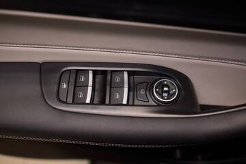Naklejka premium Modern Car Door Control Panel with Window Switches for convenience and functionality