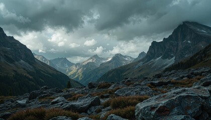 Dramatic stormy mountains under overcast skies, adventure awaits