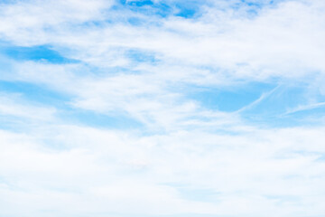 hazy clouds in blue sky