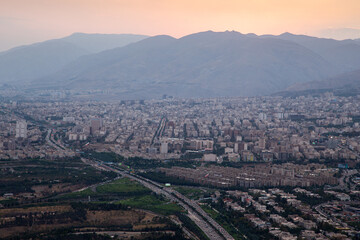 aerial view of city with mountains in the background during sunset tehran iran