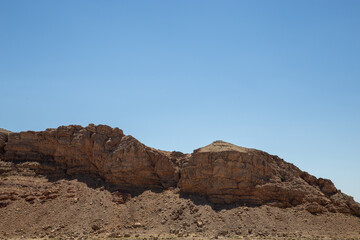 rocks  and cliffs in the desert with clear skies
