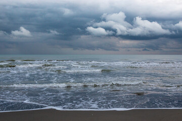 storm clouds forming over the sea waves crashing on the beach in northern iran shomal the caspian sea