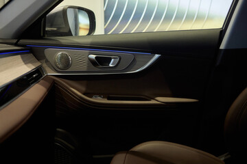 Stylish and Modern Car Interior Design Featuring Carbon Fiber Accents and Ambient Lighting