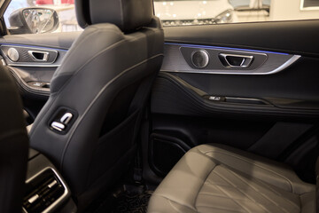 Stylish and Modern Car Interior Design Featuring Carbon Fiber Accents and Ambient Lighting
