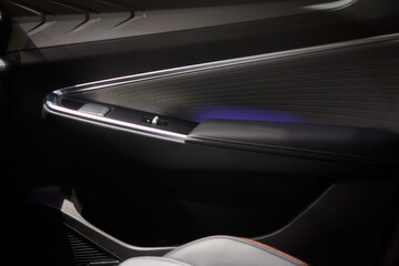 Stylish and Modern Car Interior Design Featuring Carbon Fiber Accents and Ambient Lighting