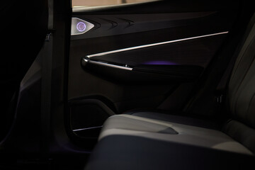 Stylish and Modern Car Interior Design Featuring Carbon Fiber Accents and Ambient Lighting
