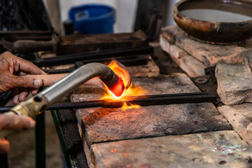 Craftsman working in a filigree workshop in Santa Cruz de Mompox, Colombia