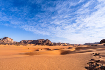 Tadrart Rouge, meaning Red Mountain, a mountain range in southeastern Algeria, part of the Algerian Desert providing massive dunes, rock formations and Martain landscapes