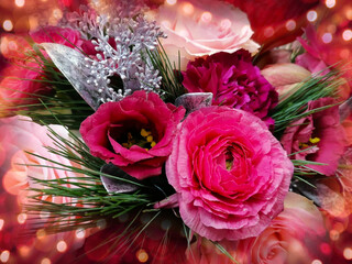 Beautiful christmas bouquet with pink ranunculus on a bokeh background stock photo images. Luxury floral christmas decoration stock photo. Christmas bouquet with red rose and green spruce branches