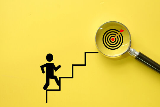Growth mindset,Goal achievement idea.,goals, focus, and achievement, perfect for business motivation and personal development concept.,Man "Climbing stairs to success with a dartboard icon.