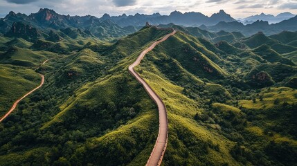 Scenic winding road through lush green mountainous terrain.