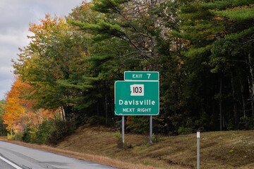 exit sign on  Interstate 89 for  Exit  7 for NH-103 toward Davisville in Warner, New Hampshire