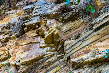 Nature force compressed cracked rock layers structure formation close-up details, in various...