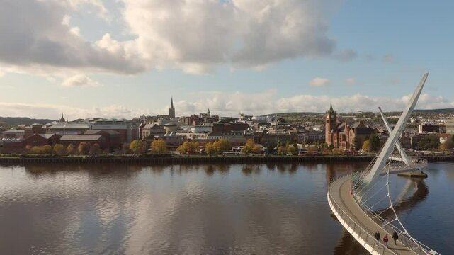 City of Derry aka Londonderry in Northern Ireland aerial view - A Beautiful Cityscape from above by the River Foyle Featuring the Beautiful Pedestrian Peace Bridge