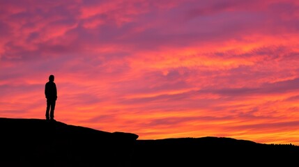 Contemplating Nature's Beauty - Silhouette of Person Admiring Sunset on Rock Ledge with Wonder and Appreciation for Natural Wonders in Valley.
