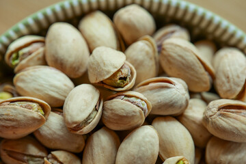 Pistachios close-up.Healthy fats.Delicious pistachio cup. Vegetarian plant-based protein source. Healthy snack 