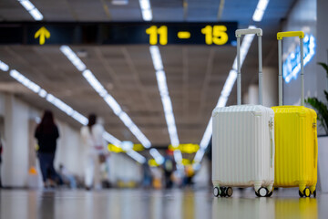 Two suitcases in an empty airport hall, traveler cases in the departure airport terminal waiting for the area, vacation concept, blank space for text message or design, travel.