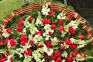 Basket with red rose and lily Saint George ribbon