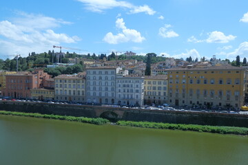 Fototapeta premium The Daily Life of the Arno River in Florence, Romantic Italy