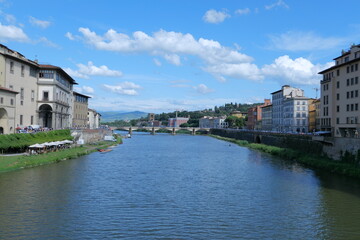 Fototapeta premium The Daily Life of the Arno River in Florence, Romantic Italy