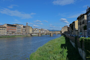 Fototapeta premium The Daily Life of the Arno River in Florence, Romantic Italy