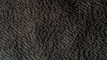 Texture of woolen fabric as a background, close-up.