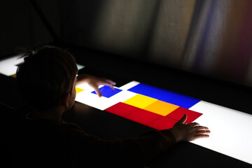 A child playing with the coulours