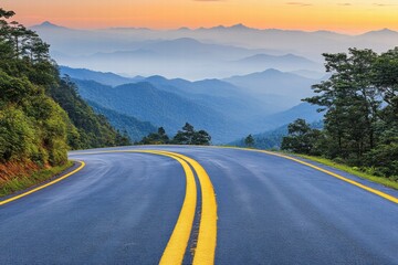 Scenic Winding Road Through Mountains at Sunrise with Vibrant Colors