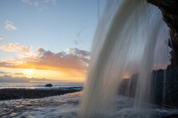 Sandcut Falls, near Sooke BC Canada shines in sunset golden light