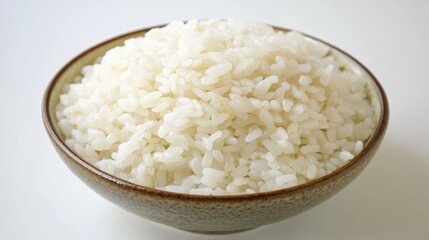 close up of a bowl of cooked white rice against a white background, healthy eating