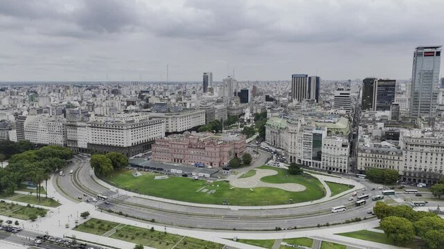 Drone facing Casa Rosada from east, lowers over Rio Darsena Sur in Buenos Aires, Argentina
