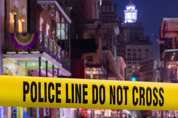Obraz premium Photo illustration of police cordon tape across Bourbon Street in New Orleans, Louisiana, USA.
