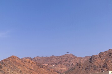 View of rocky hills with clear blue sky in Saudi Arabia