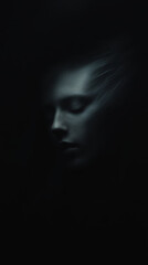 serene, abstract representation of face in dark tones, evoking sense of calm and introspection. blurred features create dreamlike quality