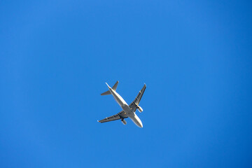 Passenger flight on the air with blue sky