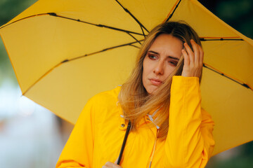 Woman Walking in Windy and Rain Tempest Weather Outdoors. Person having trouble holding umbrella in bad weather season
