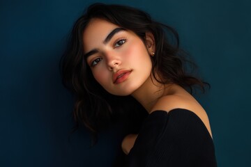 Fototapeta premium Stunning Portrait of a Young Woman with Natural Beauty Against a Dark Background