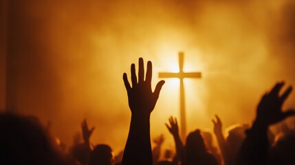 Fototapeta premium Worship God concept: Silhouette christian people hand rising over blurred cross on spiritual light background