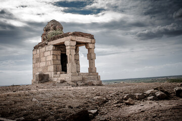 Ancient Temple Amidst Rocky Landscape and Cloudy Skies in Pudukottai Tamilnadu