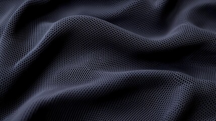 Velvet abstract background idea. Close-up view of textured black mesh fabric with intricate patterns and smooth draping.