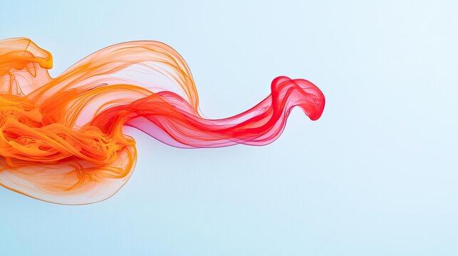 Ink abstract background concept. Abstract swirling smoke forms in vibrant orange and red hues against a soft blue backdrop.