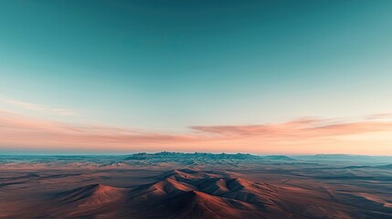 Fototapeta premium Pastel skies idea. Stunning aerial view of mountains and valleys under a colorful sunset sky.